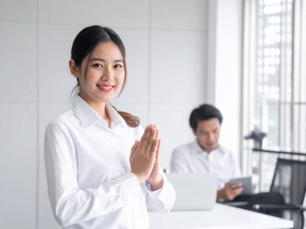 Firefly_thai female service employeewearing a white shirt in the white office, is thanking th 579199 (1)